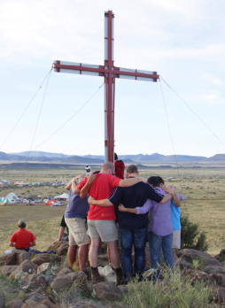 Men at the cross which overlooks the KMMC campsite at KMMC 2014.
