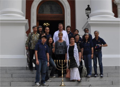 The mission group in front of Parliament in Cape Town, with a menorah they released there.