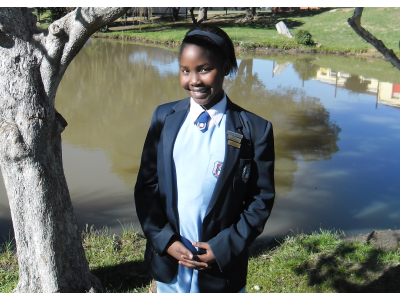Siphosethu Bahyi at the dam at Walmer West Primary School, Port Elizabeth where, in a vision, she saw 'men' with bodies of molten lava.