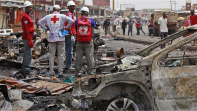May 21, 2014: In this file photo, Red Cross personnel search for remains at the site of one of a car bomb in Jos, Nigeria. Boko Haram militants are taking over villages in northeastern Nigeria, killing and terrorizing civilians and political leaders, witnesses say, as the Islamic fighters make a comeback from a year-long military offensive aimed at crushing them.AP/Sunday Alamba/File