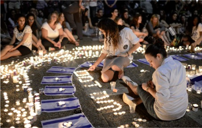 Israelis light candles in Tel Aviv's Rabin Square on Monday as they mourn the news of the death of three abducted Jewish teenagers. Israeli forces found the bodies of the three missing teenagers on Monday after a nearly three-week-long search. (Tomer Neuberg/Flash90) - See more at: http://www.gospelherald.com/articles/51813/20140703/israel-vows-that-hamas-terrorist-group-will-pay-for-abducting-killing-teens.htm#sthash.x4MAw8G7.dpuf