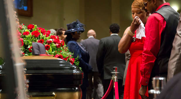 Lesley McSpadden reacts at the casket of her son Michael Brown during the funeral services at Friendly Temple Missionary Baptist Church in St. Louis Monday. (PHOTOl Reuters/Richard Perry/Pool )