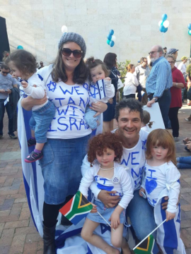 A family group expressing their support for Israel through their dress.