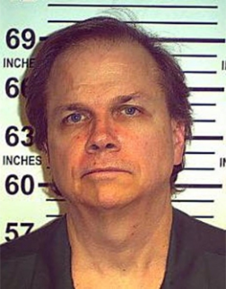 Mark David Chapman posing for a mugshot in 2013. (PHOTO: New York State Department of Corrections)