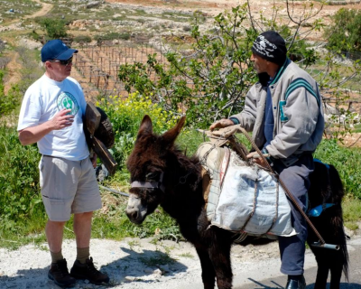  David encounters a peasant Arab man on a Donkey whilst carrying his cross and bowl through Judea. 