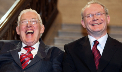 File photograph shows Northern Ireland's new first minister Ian Paisley (L) and deputy first minister Martin McGuinness smiling after being sworn in at a ceremony at Stormont, Belfast May 8, 2007. Hardline Protestant cleric and Northern Ireland's former leader Ian Paisley has died, his Democratic Unionist Party (DUP) said on September 12, 2014. (PHOTO:Photo: REUTERS / Paul Faith / Pool / Files - NORTHERN IRELAND)