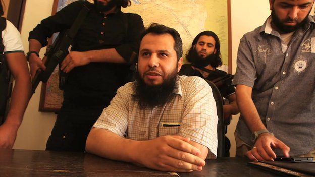 Hassan Abboud (seated) and members of the Islamic Front Hassan Abboud (seated) was the head of the political bureau of the Islamic Front alliance.