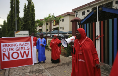 (PHOTO: REUTERS/AFOLABI SOTUNDE) A campaigner from "#Bring Back Our Girls" shouts slogans during a rally calling for the release of the chibok school girls who were abducted by Boko Haram militants, in Abuja, Nigeria, October 17, 2014. Nigeria said on Friday it had agreed a ceasefire with Islamist militants Boko Haram and reached a deal for the release of more than 200 schoolgirls kidnapped by the group six months ago.