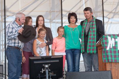 Angus Buchan prays for KMMC coordinator Jannie Moolman (right) and his wife Marelize and daughters.