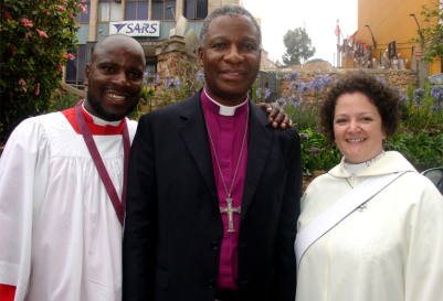 Archbishop Thabo Makgoba (centre) with Tonde James Nhererwa and The Revd Claire Phelps who were his chaplains during a Thanksgiving service