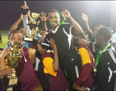 The Sakhuluntu Soccer Team receiving the trophy for being champions of the KoG Sport Touranament.  