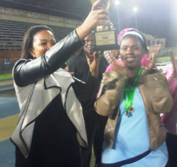 Ps Asanda Nojoko (mother of FABC) honouring the netball captain from Sakhuluntu for being the champions of the Tournament.