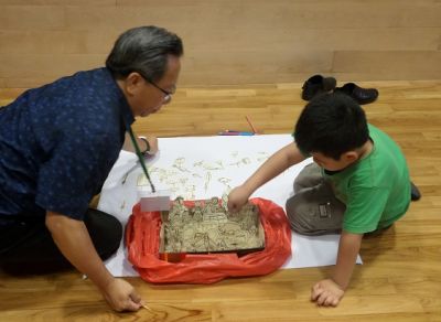 A practical session with a child during Walking with Wounded Children Course training in Singapore.