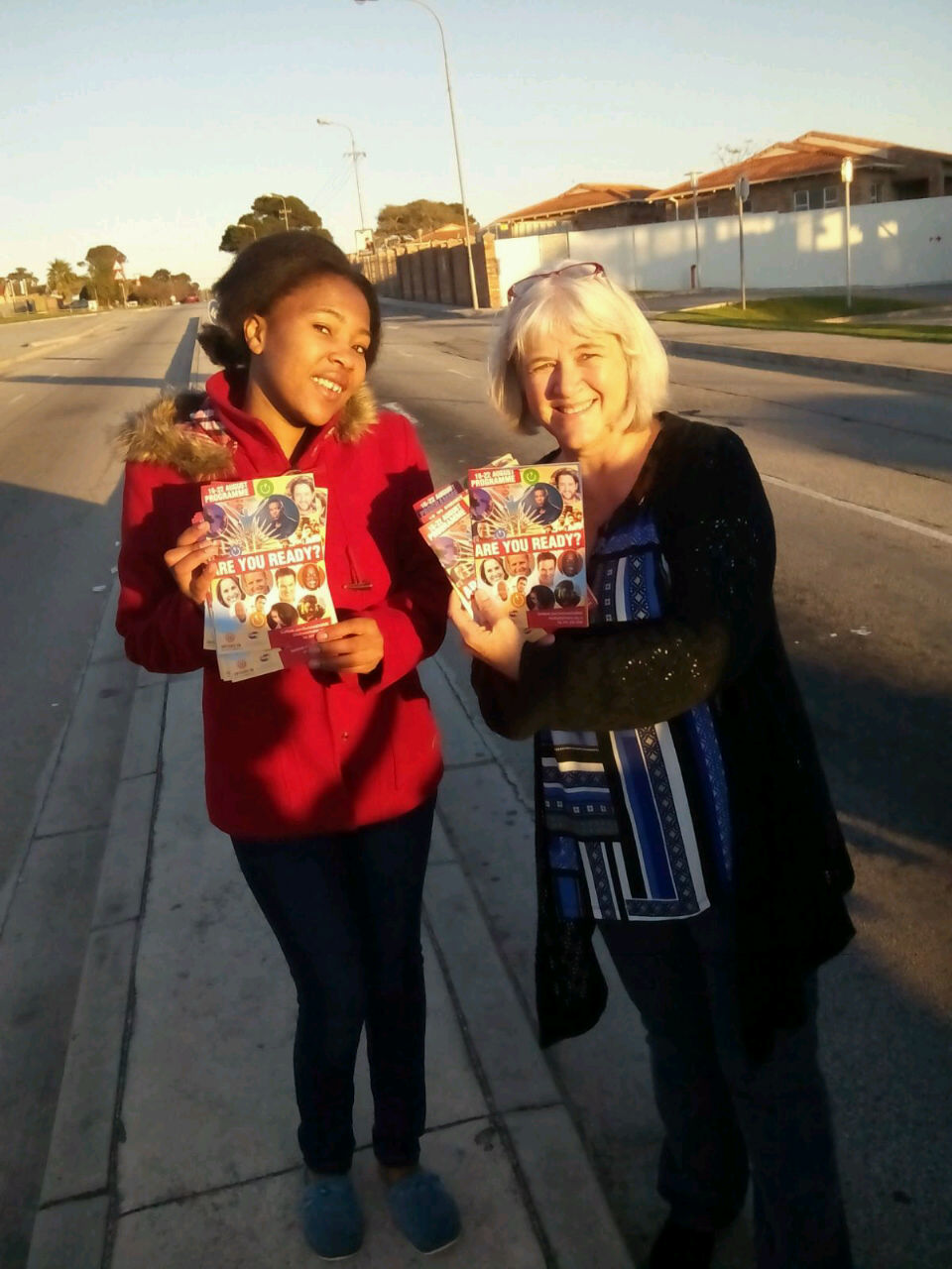 YWAM team handing out Switched On flyers