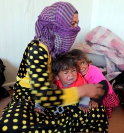 weeping-children-with-their-mother-who-fled-with-them-from-islamic-state-strongholds-of-hawija-and-shirqat-to-seek-refuge-in-a-refugee-centre-in-makhmour-south-of-mosul-iraq