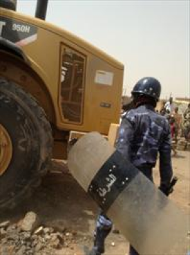 Sudanese authorities demolishing the Church of Christ in Thiba.