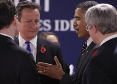 US President Barack Obama talks with British Prime Minister David Cameron during a working session at the G20 Summit in Cannes (PHOTO: AP)