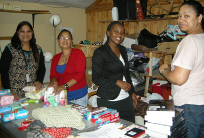 Aon staff helping with packing bags.