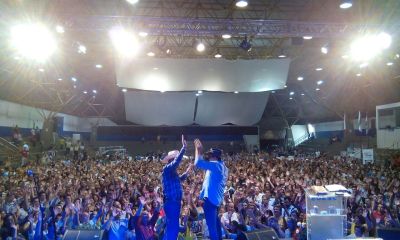 Angus Buchan (left) and his Portuguese interpreter in action at a service in Maringa, Brazil.